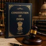 Constitution of India book with scales of justice, gavel, and legal codes on wooden table - representing writs and constitutional rights